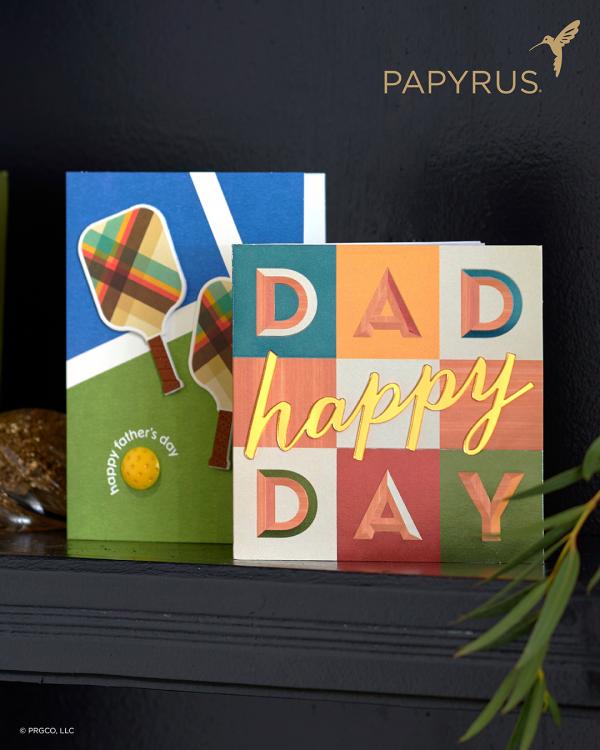Two Father's Day cards on a shelf with Papyrus logo in the corner