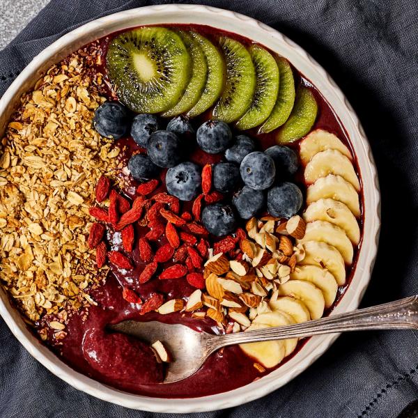 acai breakfast bowl with fresh berries, banana slices and almonds