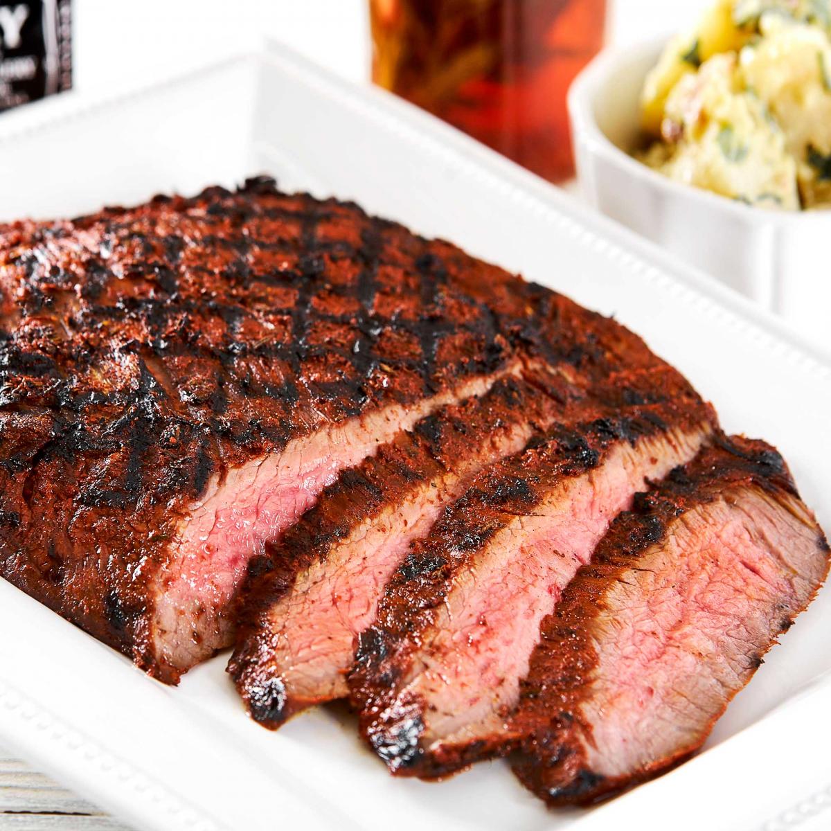 Achiote Flank Steak with jack daniels whiskey in photo