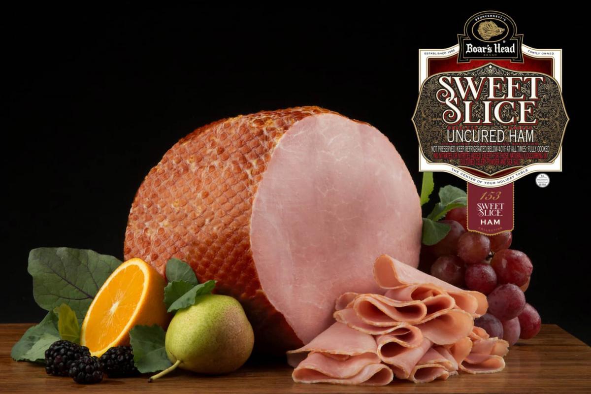 Boar’s Head ham with slices, fruit and product label