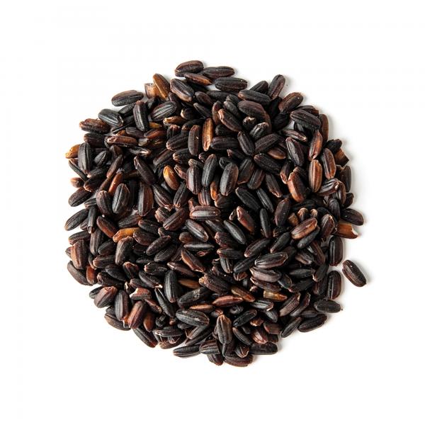 Small pile of uncooked black pearl rice grains