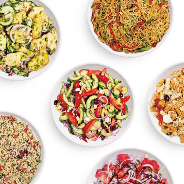 Six bowls of different chef-prepared salads from the Kitchen