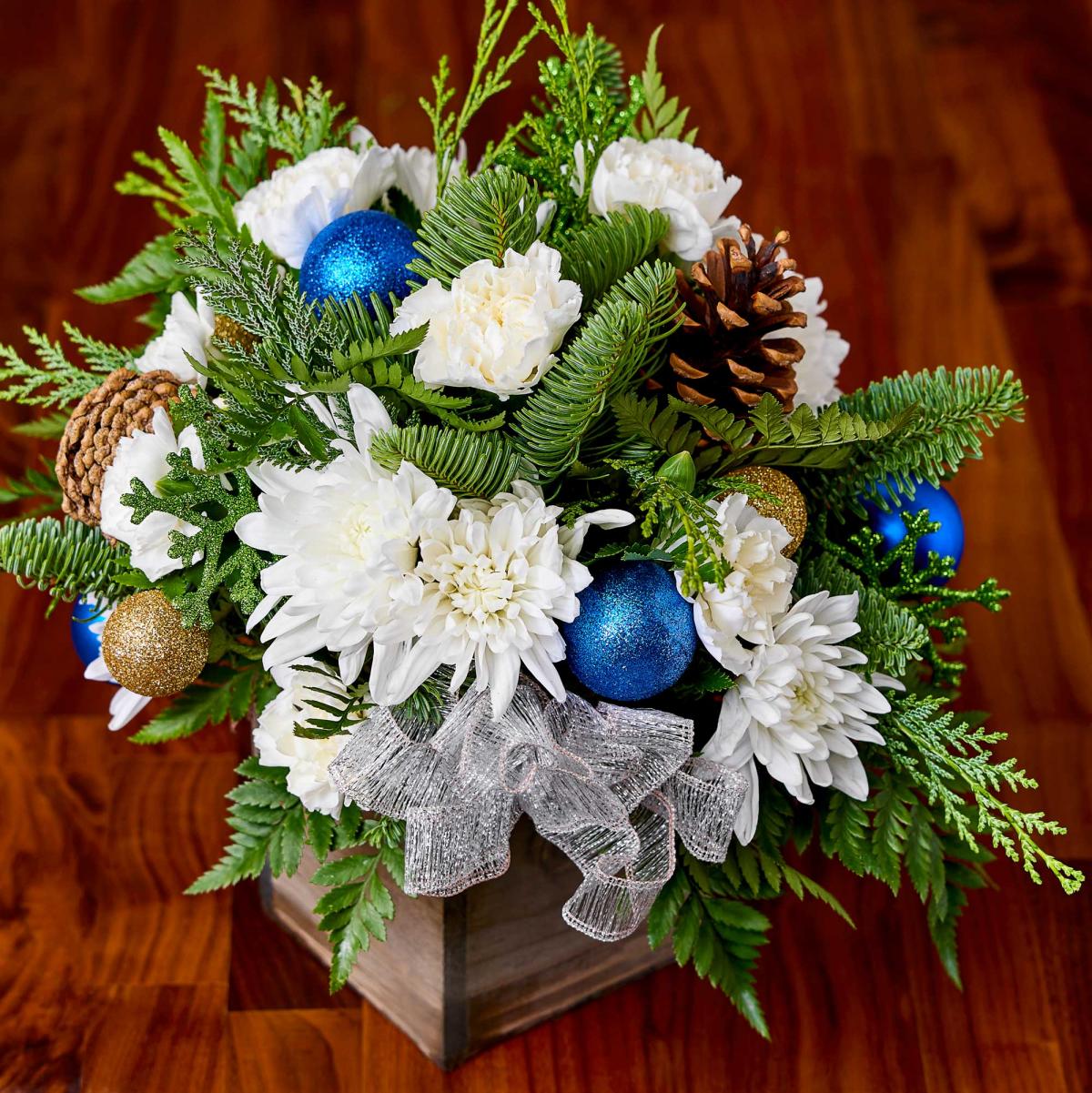 Sequoia Holiday Floral Arrangement with sparkly green and blue christmas accents