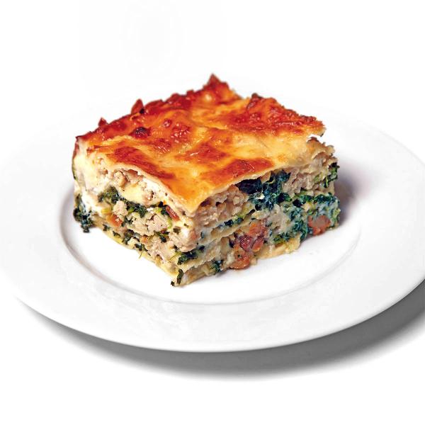 Slice of chicken garlic lasagna on plate