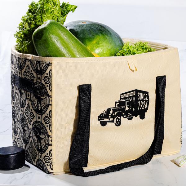 Nugget Market centennial box-style grocery bag filled with fresh, green produce