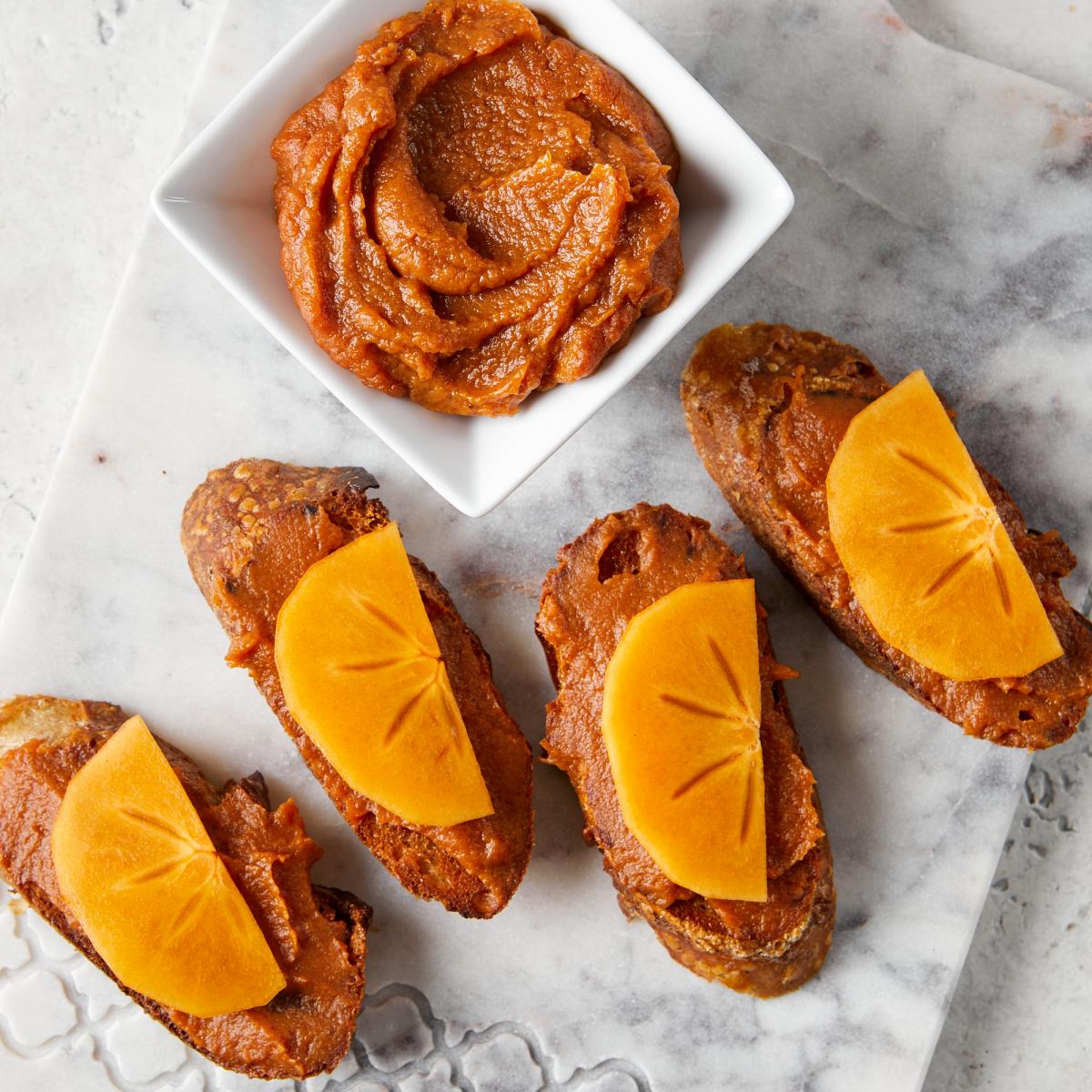 persimmon butter on small baguette crostini slices