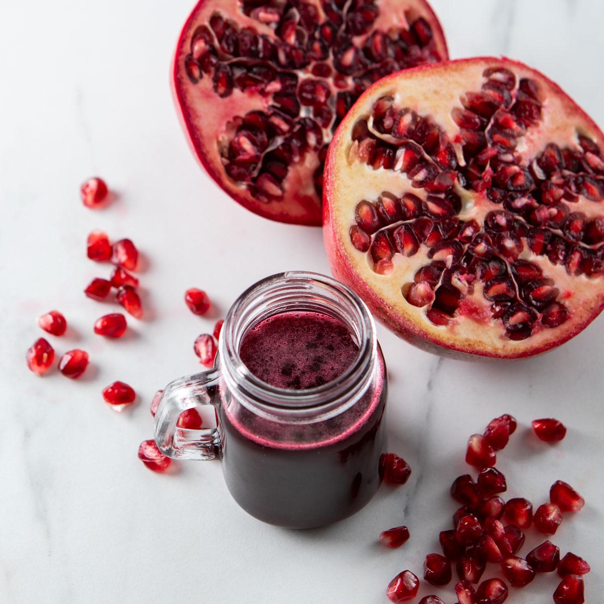 Pomegranate Molasses with pomegranates and arils