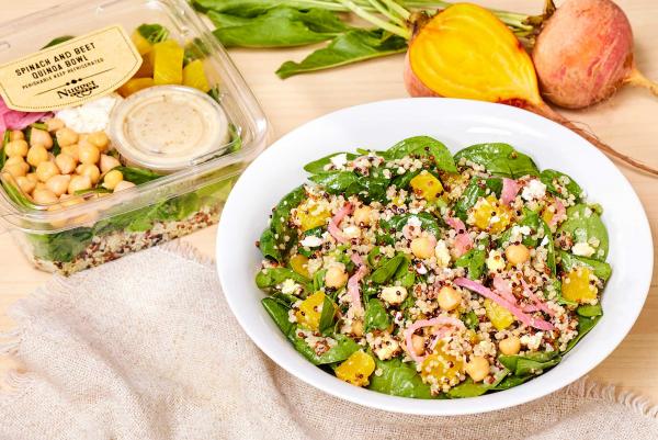 Spinach & Beet Quinoa Bowl plated and in clear package with a fresh beet and a half on the side