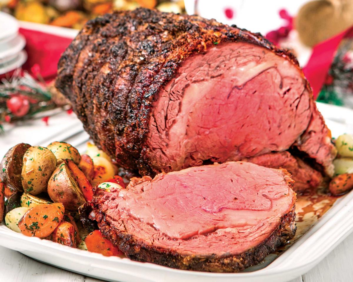 sliced Standing Rib roast on a holiday table