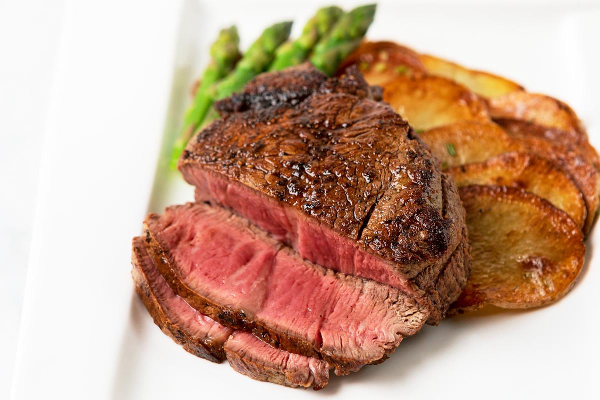 filet mignon with potato coins and asparagus