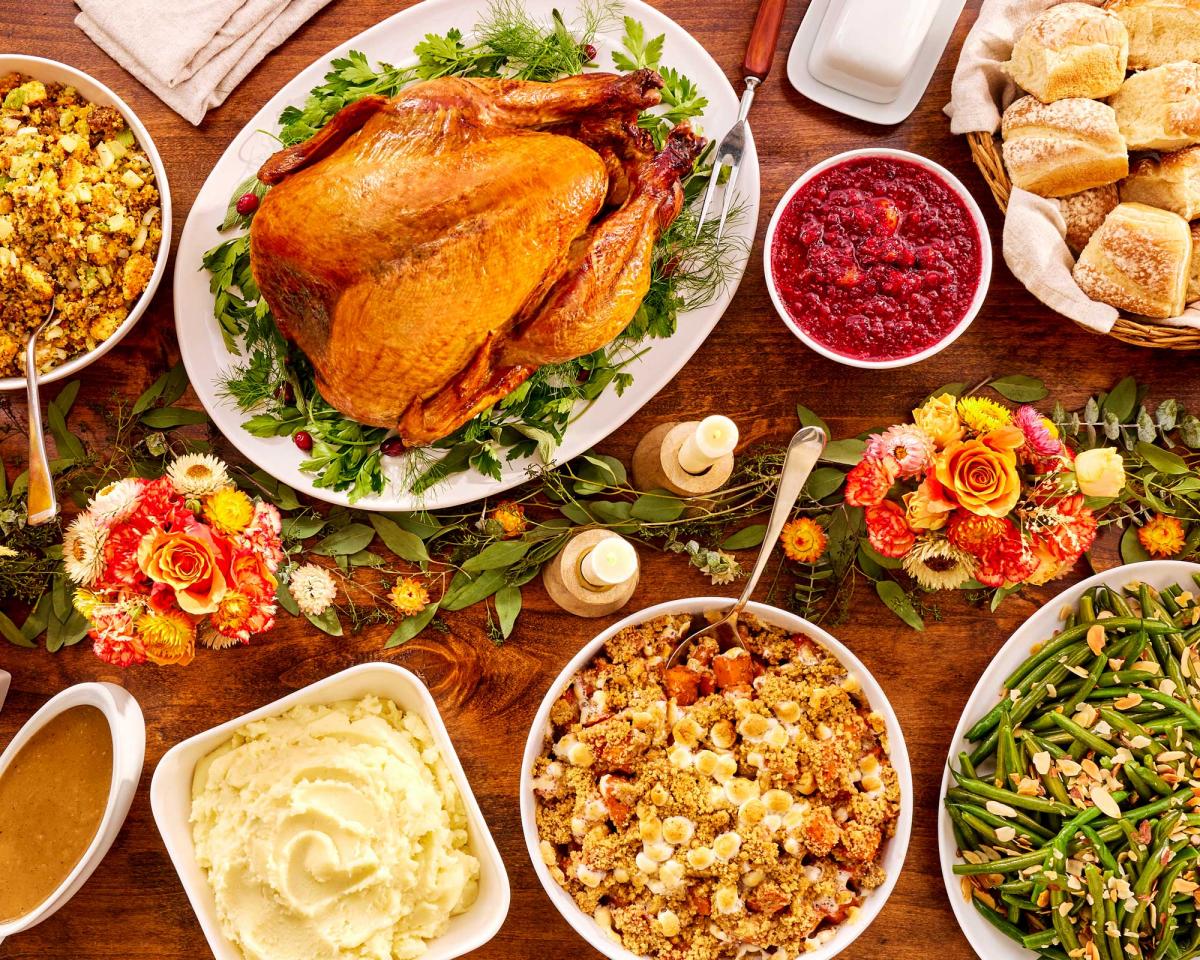 Holiday traditional meal with turkey portioned for 8-10 on a styled table setting