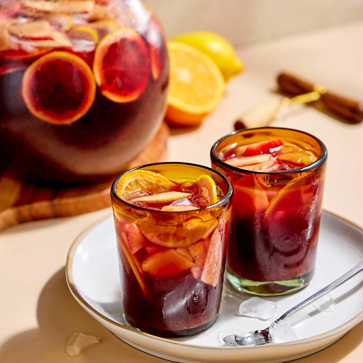 Vicki's Sangria in pitcher and poured into two cold glasses with fruits