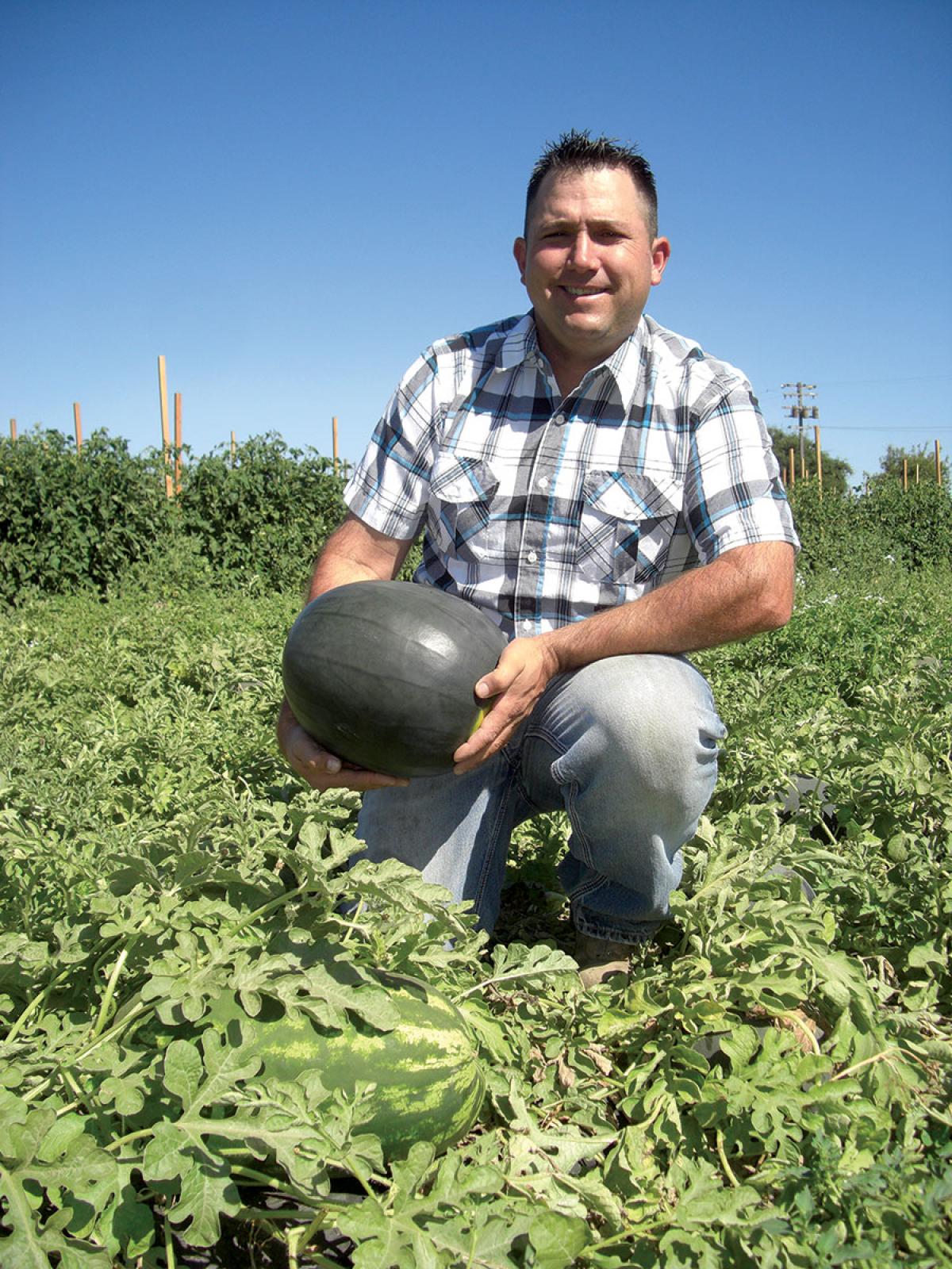 Vierra Farms farmer with a watermelon