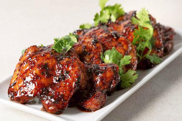 Vietnamese chicken thighs on a plate with Italian parsley